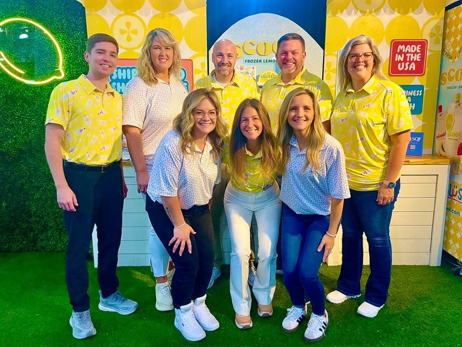 Korie Minkus with the Mary Mack's team at their trade show booth