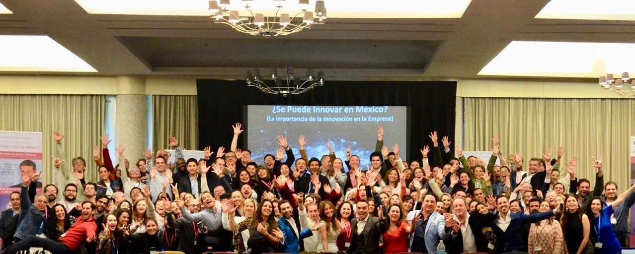 A full ballroom of founders celebrating at a live event in Mexico City