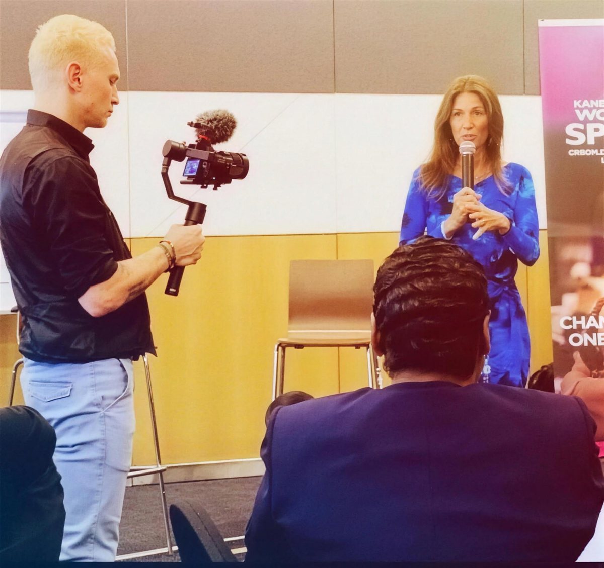 Korie Minkus speaking on camera in Zurich