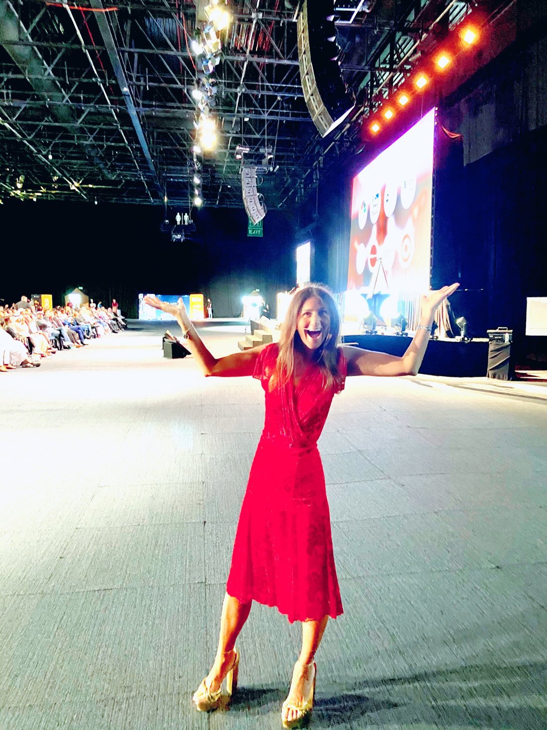 Korie Minkus on an arena stage in Dubai